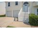 Home with a two-car garage, front steps, and manicured landscaping at 7835 Teton Trl, Douglasville, GA 30134