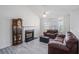 Comfortable living room with a fireplace, vaulted ceiling and lots of light at 7835 Teton Trl, Douglasville, GA 30134