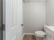 A half bathroom features a toilet, and a sink at 10 Mariner Se Way, Acworth, GA 30102