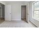 This bedroom featuring a closet and window offers a comfortable and private retreat at 10 Mariner Se Way, Acworth, GA 30102