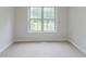 Bedroom with a window and neutral carpeting allows for a customizable living space at 10 Mariner Se Way, Acworth, GA 30102