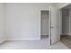 Bedroom featuring modern carpet, closet, and an open door for easy access at 10 Mariner Se Way, Acworth, GA 30102
