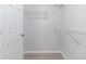 A walk-in closet with shelving provides well-organized storage at 10 Mariner Se Way, Acworth, GA 30102