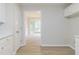 A dining room is viewed from the kitchen, enhancing the open and connected living space at 10 Mariner Se Way, Acworth, GA 30102