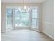 Bright dining room featuring a large bay window and modern chandelier at 10 Mariner Se Way, Acworth, GA 30102