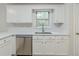 Cozy kitchen boasts stainless steel appliances, white cabinets, and bright countertop at 10 Mariner Se Way, Acworth, GA 30102
