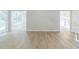 Bright living room features hardwood floors, white trim and access to outdoor deck at 10 Mariner Se Way, Acworth, GA 30102