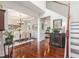 Elegant dining room with hardwood floors, chandelier, trim accents, and access to living spaces at 122 Susobell Pl, Woodstock, GA 30188