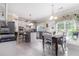 Bright kitchen features white cabinets, stainless appliances, and a center island with counter seating at 122 Susobell Pl, Woodstock, GA 30188