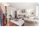 Cozy living room with hardwood floors, french doors, neutral tones, and comfortable furnishings at 122 Susobell Pl, Woodstock, GA 30188