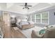 Primary bedroom with tray ceilings, a ceiling fan, lots of natural light, and neutral paint at 122 Susobell Pl, Woodstock, GA 30188