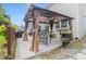 A lovely patio with a shaded pergola, perfect for outdoor relaxation and dining at 122 Susobell Pl, Woodstock, GA 30188
