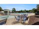 Community pool area featuring a mushroom fountain, lounge chairs, and tables for residents at 122 Susobell Pl, Woodstock, GA 30188