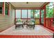 Relaxing screened-in back porch featuring comfortable seating and stylish decor at 2850 Seagrave Way, Marietta, GA 30066