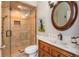 Updated bathroom featuring a tiled walk-in shower and vanity with marble countertop and elegant fixtures at 2850 Seagrave Way, Marietta, GA 30066