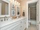 Beautiful bathroom featuring double sinks, white cabinetry, modern fixtures, and a separate tub and toilet area at 2850 Seagrave Way, Marietta, GA 30066