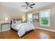 Bedroom with hardwood floors, large windows, and neutral paint color at 2850 Seagrave Way, Marietta, GA 30066