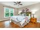 Cozy bedroom featuring a comfortable bed, hardwood floors, ample natural light, and tasteful decor at 2850 Seagrave Way, Marietta, GA 30066