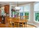 Cozy breakfast nook featuring a wooden table and large windows, adjacent to the kitchen area, perfect for casual dining at 2850 Seagrave Way, Marietta, GA 30066