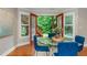 Cozy dining area with views of the backyard, featuring a round glass table and seating for four at 2850 Seagrave Way, Marietta, GA 30066
