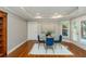 Bright dining room with hardwood floors, a glass table with seating for four, and abundant natural light at 2850 Seagrave Way, Marietta, GA 30066