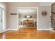 Open dining room with a wooden table, wainscoting, and hardwood floors at 2850 Seagrave Way, Marietta, GA 30066