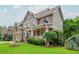 Charming home featuring a well-maintained lawn and lush landscaping with an inviting covered porch at 2850 Seagrave Way, Marietta, GA 30066