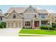 Charming two-story home with a manicured lawn, two-car garage and inviting front porch at 2850 Seagrave Way, Marietta, GA 30066