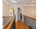Upstairs hallway with hardwood floors, and views into adjacent rooms at 2850 Seagrave Way, Marietta, GA 30066