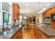 Spacious kitchen with stainless steel appliances, granite countertops, hardwood floors, and an open layout to the living area at 2850 Seagrave Way, Marietta, GA 30066