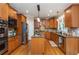 Well-equipped kitchen with stainless steel appliances, granite countertops, wooden cabinets, and a functional center island at 2850 Seagrave Way, Marietta, GA 30066