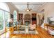Charming living room boasts a stone fireplace, built-in shelves, high ceilings, and large windows with natural light at 2850 Seagrave Way, Marietta, GA 30066
