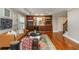 Inviting living room with hardwood floors, built-in bookshelves, and a stylish leather sofa at 2850 Seagrave Way, Marietta, GA 30066