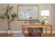 Well-lit office space featuring a wooden desk, chair, artwork, and decorative accents at 2850 Seagrave Way, Marietta, GA 30066