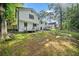 A view of the two story house from the spacious backyard and showing decks at 3232 Valley View St, Powder Springs, GA 30127