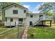 A view of the two story house from the spacious backyard and showing decks at 3232 Valley View St, Powder Springs, GA 30127