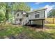 A view of the two story house from the spacious backyard and showing decks at 3232 Valley View St, Powder Springs, GA 30127