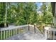 Relax on the wood deck with views of the spacious backyard at 3232 Valley View St, Powder Springs, GA 30127
