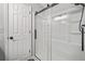 Bathroom featuring sliding glass doors and shelving at 3232 Valley View St, Powder Springs, GA 30127