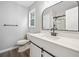 Bathroom featuring white vanity, large mirror, and walk-in shower at 3232 Valley View St, Powder Springs, GA 30127
