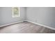 This bedroom offers natural light and updated flooring to suit modern living at 3232 Valley View St, Powder Springs, GA 30127