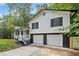 Exterior view of a home with white siding and a black roof and shutters at 3232 Valley View St, Powder Springs, GA 30127