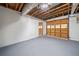 Spacious garage featuring an overhead door and ample room for storage and parking at 3232 Valley View St, Powder Springs, GA 30127