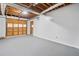 Spacious garage featuring an overhead door and ample room for storage and parking at 3232 Valley View St, Powder Springs, GA 30127