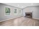 Bright living room with sleek floors and a stunning fireplace, perfect for gatherings at 3232 Valley View St, Powder Springs, GA 30127