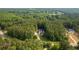 A sprawling home nestled in a private, heavily wooded lot with a lake nearby at 390 Glengarry Chase, Covington, GA 30014