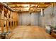 Unfinished basement offering potential with exposed framework and concrete walls for customization at 390 Glengarry Chase, Covington, GA 30014