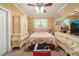 Charming bedroom with an ornate armoire, dresser, and a cozy bed, creating a comfortable retreat at 390 Glengarry Chase, Covington, GA 30014
