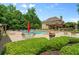 Large community pool and lounge area surrounded by mature trees, great for relaxation and recreation at 390 Glengarry Chase, Covington, GA 30014