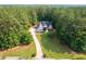 An inviting home with a long driveway and meticulously maintained lawn at 390 Glengarry Chase, Covington, GA 30014